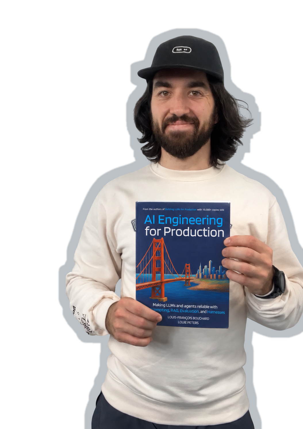 Louis-François Bouchard holding his book AI Engineering For Production