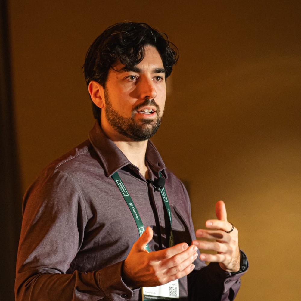Louis-François Bouchard speaking on stage, square crop