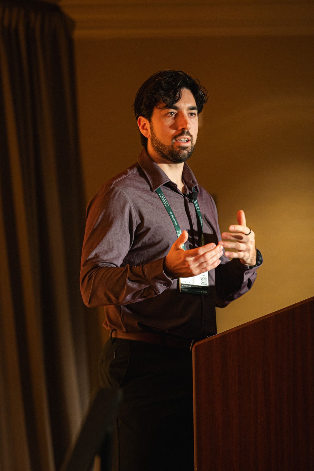Louis-François Bouchard speaking on stage at an AI engineering conference